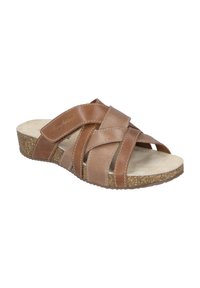 Braune Leder-Sandalen mit überkreuzten Riemen, korkähnlicher Sohle und offenem Zehenbereich. Weiche Innenauskleidung für Komfort. Verstellbarer Riemen.