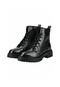 Botas de cuero negro hasta el tobillo con un diseño de cordones, punta redonda y suelas resistentes. Presenta ojales metálicos y una lengüeta en el collar.