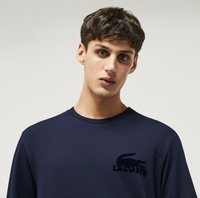 Sudadera de algodón azul marino con cuello redondo y un logo de Lacoste bordado en el lado izquierdo del pecho. Corte regular y textura suave.