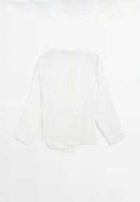 Witte lange mouw shirt, textuurstof, v-hals ontwerp, licht oversized, met een gebogen zoom en knoopmanchetten.