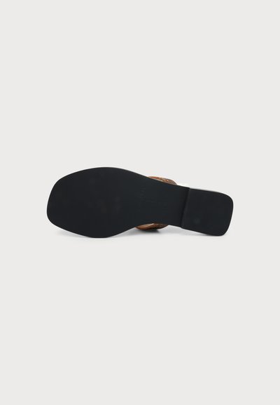 Sandal with a flat black sole and a square toe, viewed from the bottom on a plain light background.