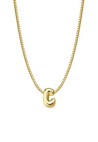 Zelta piekariņš ar kaklarotu, kurai ir teksturēta burta "C" forma uz saistītā ķēdītes. Gluda virsma ar atstarojošu spīdumu. Ķēdīte ar kvadrātveida saitēm.