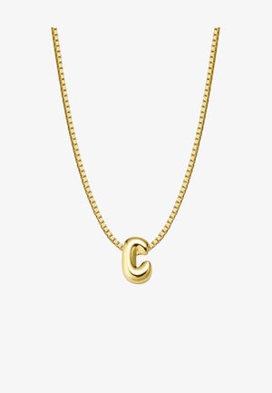 Zelta piekariņš ar kaklarotu, kurai ir teksturēta burta "C" forma uz saistītā ķēdītes. Gluda virsma ar atstarojošu spīdumu. Ķēdīte ar kvadrātveida saitēm.