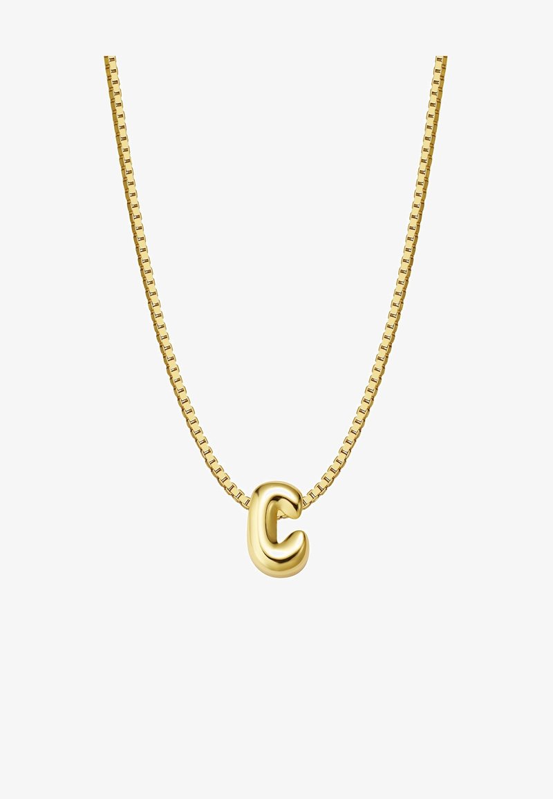 Zelta piekariņš ar kaklarotu, kurai ir teksturēta burta "C" forma uz saistītā ķēdītes. Gluda virsma ar atstarojošu spīdumu. Ķēdīte ar kvadrātveida saitēm.