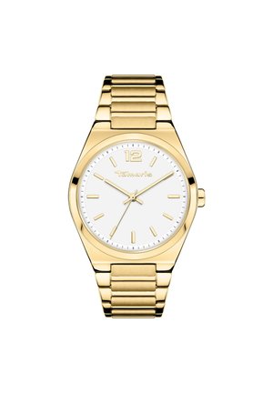 Goudkleurig roestvrijstalen horloge met een witte wijzerplaat, met ronde uurmarkeringen, gouden wijzers en een strakke schakelarmband. Gemarkeerd met "Tamaris."