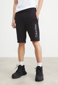 Calvin Klein - DEGRADE LOGO  - Tracksuit bottoms - black Thumbnail Image 1