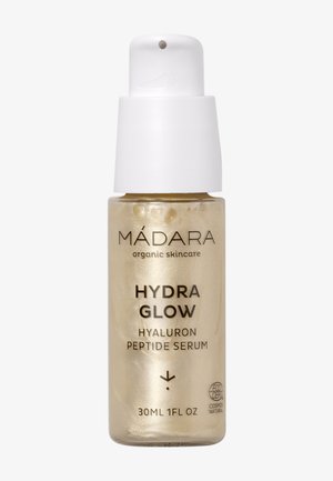 Flacon en verre avec pompe blanche, étiqueté Madara Hydra Glow Hyaluron Peptide Serum, 30ml, produit de soin de la peau bio.