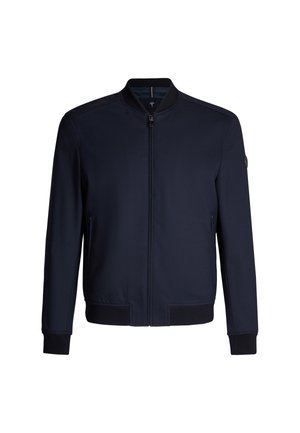 Giacca bomber blu navy, tessuto leggero, polsini e orlo a coste, chiusura con zip, tasche laterali e un'etichetta rotonda sul maniche.