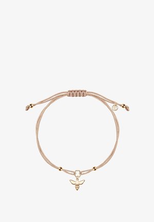 Złoty wisiorek w kształcie pszczoły na bransoletce z jasnobeżowego sznurka, z heksagonalnym charms'em i regulowanym zapięciem z złotymi akcentami.