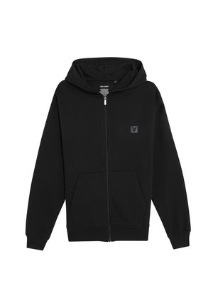 Hoodie zippé noir en tissu doux, avec une poche kangourou, une capuche et un petit patch logo sur la poitrine gauche. Design et texture simples.
