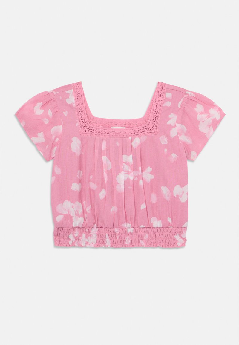 Blouse rose à manches courtes avec un décolleté carré, ornée de motifs floraux blancs, avec une texture froncée et un ourlet élastique pour un ajustement décontracté.