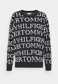 Marineblauer Pullover mit weißem Text "TOMMY HILFIGER", ausgestattet mit einem runden Ausschnitt und langen Ärmeln, aus einem weichen Strickmaterial gefertigt.