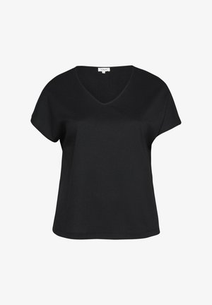 Blouse noire pour femme à manches courtes avec col en V, coupe ample et petite étiquette de marque à l’intérieur du col.