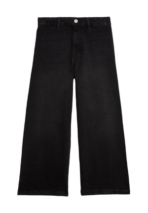 Jean large noir en denim avec une texture lisse. Présente une fermeture à bouton et zip à l'avant, ainsi que des détails de couture à l'ourlet.