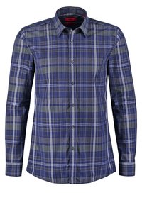 Camisa a cuadros azul marino con mangas largas, cuello abotonado y patrones de cuadros en verde y gris contrastantes. Fabricada en tejido de punto.