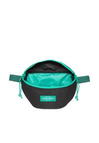 Borsa nera con interno turchese e zip abbinata. Presenta strap laterali elastici e una patch con logo. Design arrotondato con superficie liscia.