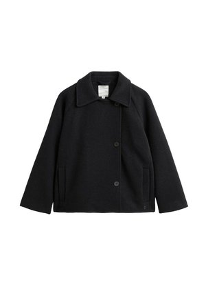 Black wool coat with a notched collar, raglan sleeves, front buttons, and side pockets; smooth texture and simple design.
