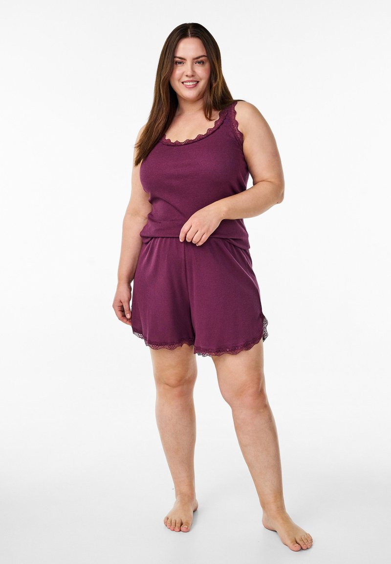Purple cotton sleep set featuring a sleeveless top with lace trim and matching shorts with scalloped edges. Smooth texture, relaxed fit.
