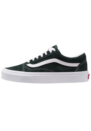 Lavtops sort ruskind sneakers med hvid bølget stribe, hvide snørebånd og tyk hvid gummisål.