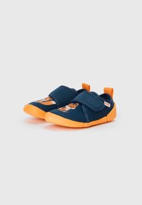 Blue fabric shoes with orange soles, featuring a velcro strap and a fox graphic on the toe. Durable and lightweight design.