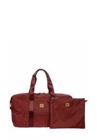 Borsa duffel color magenta con un tessuto liscio e resistente, dotata di due manici e una tasca staccabile più piccola. Hardware dorato e dettagli del logo presenti.