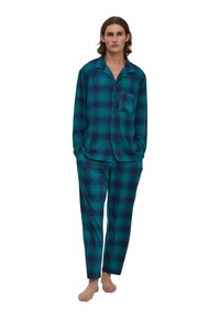 Pajama set w kratkę w kolorze turkusowym i ciemnopurpurowym. Longsleeve z guzikami i kieszonką, w połączeniu z dopasowanymi spodniami typu tapered. Gładka faktura materiału.