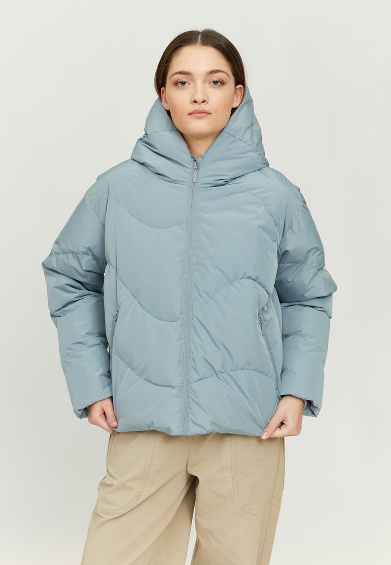 Light blue puffer jacket with a high collar and zip closure. Features quilted pattern, two side pockets, and a soft texture.