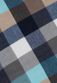 Plaid fabric featuring squares of teal, navy, gray, brown, and white. Texture varies between smooth and ribbed weaves.