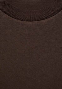 Brown cotton t-shirt fabric with a ribbed round neckline. Soft texture with a smooth finish. Even color distribution without patterns.