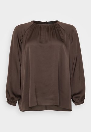 Brown long-sleeve blouse made of smooth fabric with a loose fit, featuring a round neckline and gathered detailing at the shoulders and cuffs.