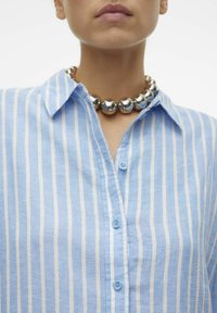 Light blue striped shirt with a button-up design; features a collar and a silver bead necklace around the neck, showcasing glossy accents.