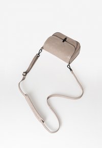 Light gray crossbody bag made of smooth suede, featuring a dual zippered top, detachable strap, and minimalistic design.