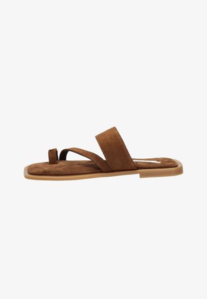 Brown suede flat sandal with toe loop and wide strap, rubber sole, side view on white background.