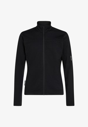 Schwarze Langarmjacke mit Reißverschluss und hohem Kragen, taillierte Passform und dezenten Markenetiketten an den linken Ärmel und der linken Seitennaht.