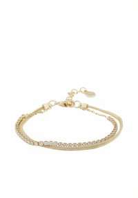 Guldcuff med två trådar: en med små kristaller och en slät kedja, den andra med en strukturerad, tvinnad design. Förlängs med en spänne.