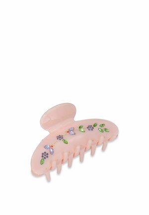 Pink plastic hair claw with an oval shape, features decorative floral accents in purple, green, and orange, with six gripping prongs.