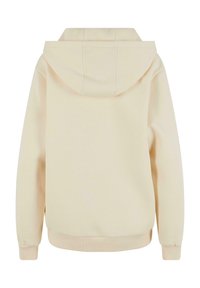 Hoodie in zacht beige, met een gladde textuur, geribde mouwen en zoom. De achterkant toont een relaxte pasvorm en gestikte details.