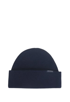 Cappello beanie a coste in navale con risvolto, realizzato in un morbido materiale a maglia. Presenta un piccolo etichetta del marchio sul risvolto.