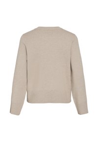 Šviesiai smėlio spalvos megztinis su ilgomis rankovėmis, apvaliu kaklu ir šoninėmis plyšimis apačioje. Minkšta tekstūra, laisvas fasonas, be siūlių nugaros dizainas.