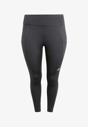 Leggings atléticos negros con una tela suave y elástica; cuentan con bolsillos laterales y un logo blanco en la parte inferior de la pierna. Diseño de cintura alta.