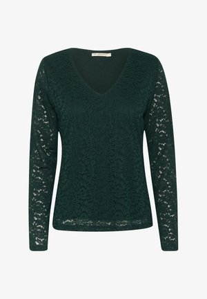 Dunkelgrünes langärmliges Oberteil aus Spitze, mit einem V-Ausschnitt und floralen Mustern im gesamten Stoff, der eine strukturierte Optik aufweist.