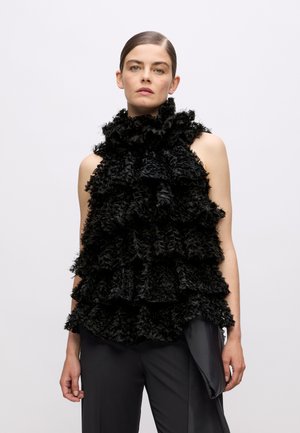 Black sleeveless top featuring a high ruffled collar and layered ruffles. The texture is soft and fluffy, designed with a structured silhouette.