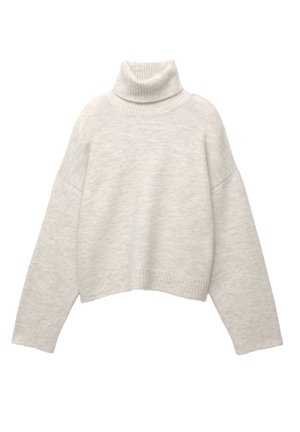 Kerman turtleneck neule, jossa on ribbireunukset kauluksessa ja helmoissa, sekä lyhyt malli ja irtonaiset, pudotetut olkapäät. Pehmeä kangas.