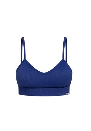 Marineblauwe geribde bralette met dunne verstelbare straps en een V-hals ontwerp. Beschikt over een merklabel aan de zijkant en een aansluitende band.