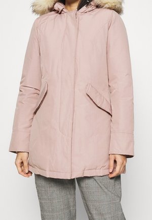 Light pink padded parka with a faux fur hood, front zip, and side pockets. Smooth fabric with a relaxed fit and mid-length design.