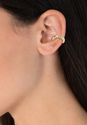 Gold-tone ear cuff featuring five small, colorful gemstones in pink and blue, curved design, textured finish, worn on the outer ear.
