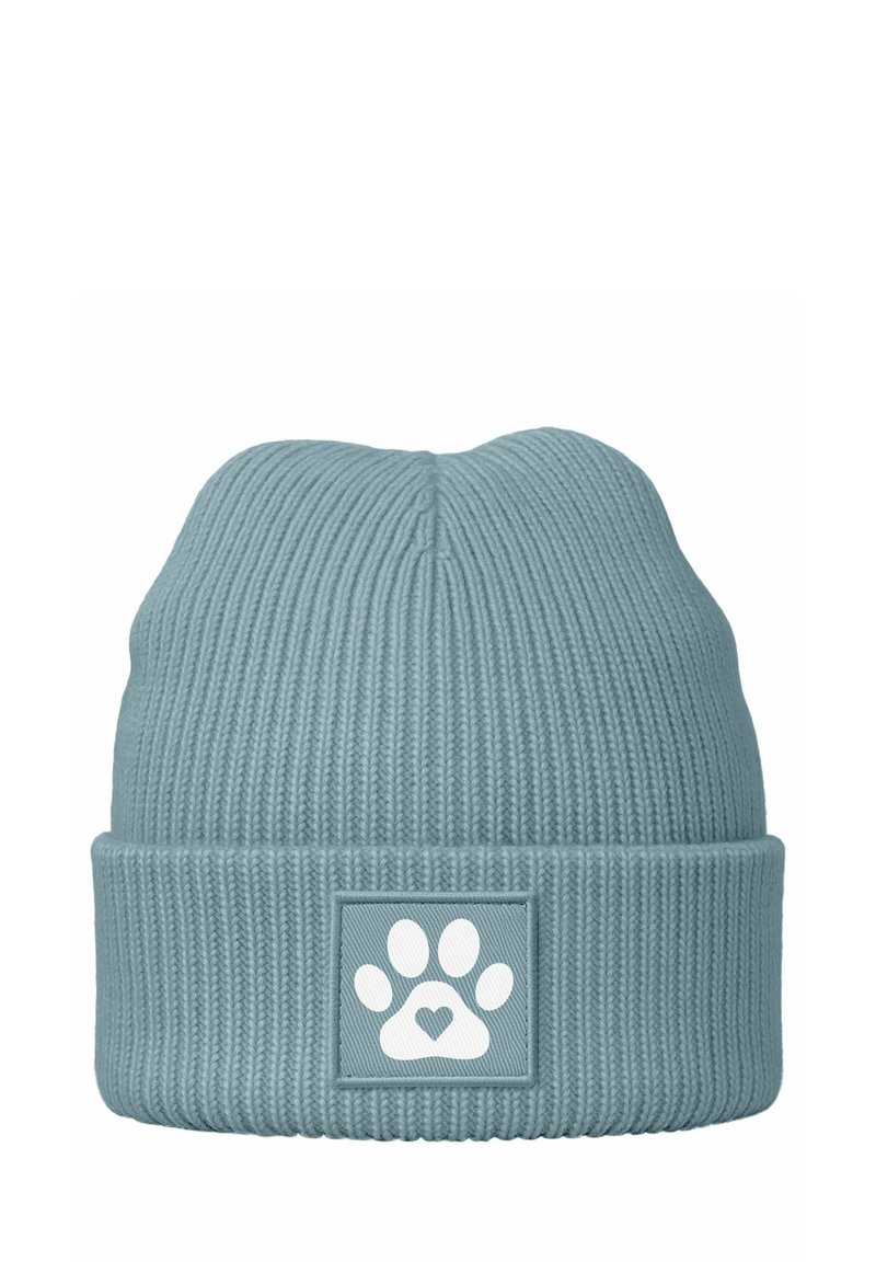 Cable knit beanie in light blue with a ribbed design. Features a square patch with a white paw print and heart motif.