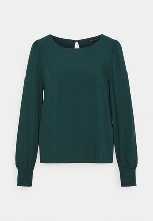 Dark green long-sleeve blouse with round neckline, gathered cuffs, and small keyhole button closure at the back.