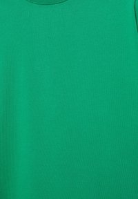 Solid green fabric with a ribbed crew neck, showing smooth texture and no visible patterns or logos.