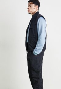 Nike Sportswear TECH WOVEN - Παντελόνι cargo - black